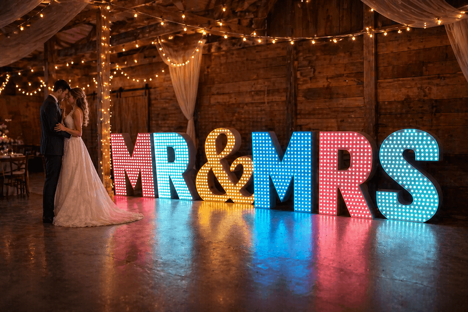 Illuminated MR & MRS marquee letters at a wedding reception